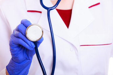 Woman doctor nurse with stethoscope isolated