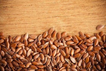 Healthy diet. Flax seeds linseed border on wooden background
