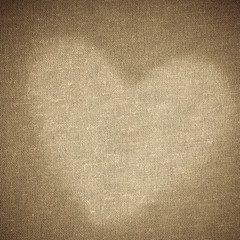 Valentine's day background. Heart shape design on brown canvas
