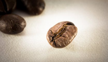 roasted coffee beans on the paper