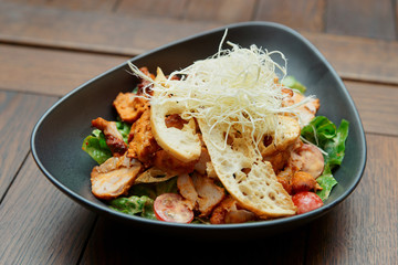 Appetizer with grilled chicken, cheese and croutons