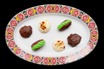 Chocolate candies in oriental style plate