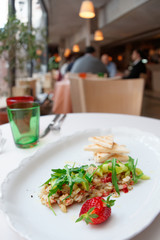 Seabass carpaccio on restaurant table