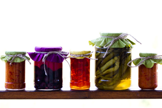 Rustic Jars Of Home Made Delicacies (marmalade And Pickles)