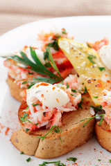 Crab meat with toast, sauce and fresh herbs