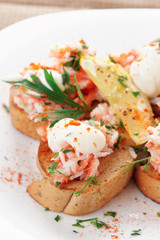 Crab meat with toast, sauce and fresh herbs