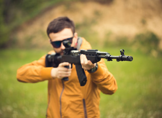 A man with an automatic rifle