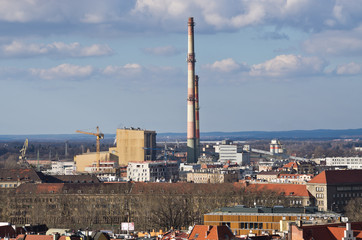 Factory with chimneys in the city