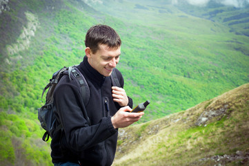 Male tourist holding GPS