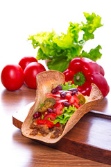 Mexican tacos in tortilla shells with fresh vegetables