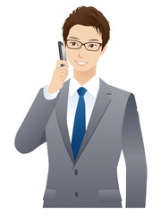 若いビジネスマン　携帯電話