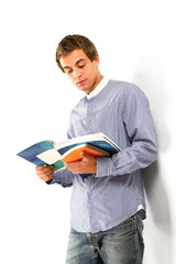 Obraz na płótnie Canvas young college guy with books