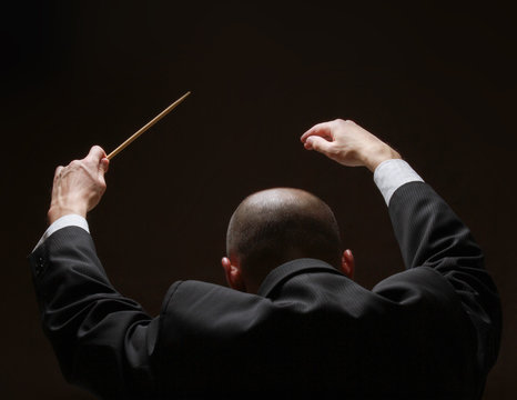 Concert conductorwith a baton