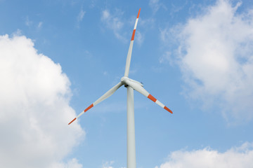 Wind energy turbine in front of blue sky