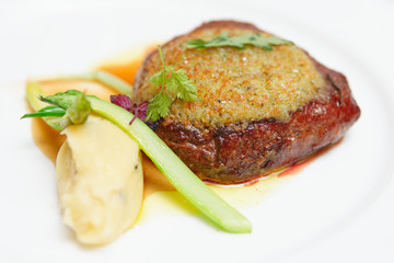 Steak with potato mash in plate