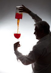 Man, pouring the wine into the glass