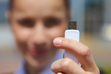Fototapeta premium hand holding black USB data storage