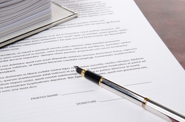 Pen on a paper to sign