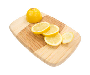 Lemon slices on wood cutting board