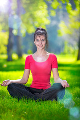 Young woman doing yoga exercises