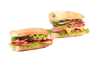 Two appetizing sandwiches with cheese.