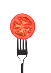 Red juicy tomato on fork.