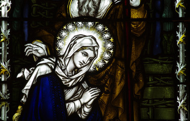 Mary praying in stained glass