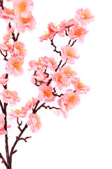 Branch of gentle pink artificial flowers.