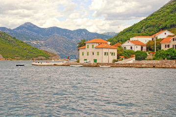 Fototapeta premium Old fishing village with pier, Kotor Bay, Montenegro.