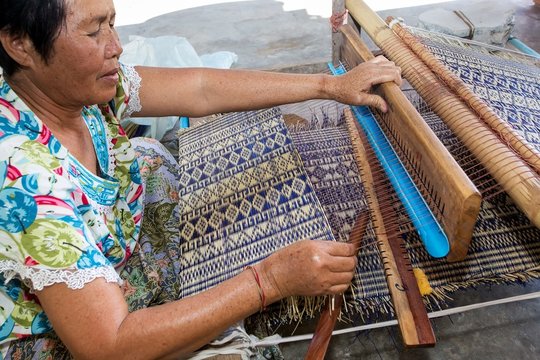 Thai Woman Weaving Straw Mat