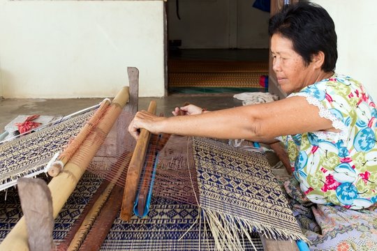 Thai Woman Weaving Straw Mat