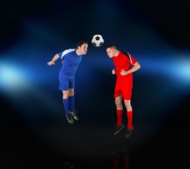 Obraz premium Football players tackling for the ball