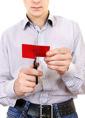 Teenager cutting a Credit Card