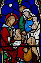 Jesus Christ blessing a child in stained glass