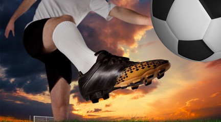 Composite image of football player in white kicking © WavebreakMediaMicro