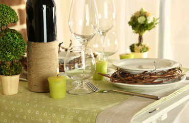 Beautiful holiday Easter table setting in green tones,