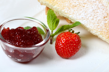 Toasts with powdered sugar and strawberry jam