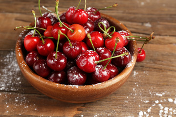 Sweet cherries on wooden table