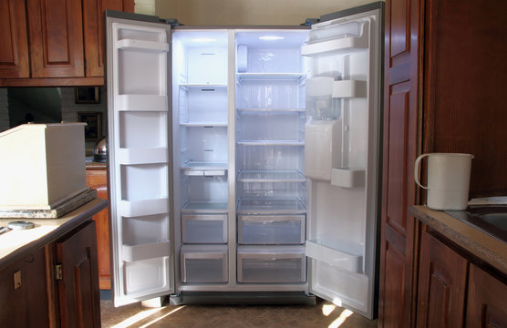 Just Unpacked New Refrigerator with Empty Shelves