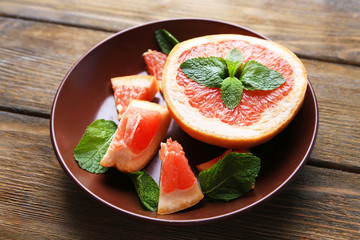 Ripe chopped grapefruit with mint leaves