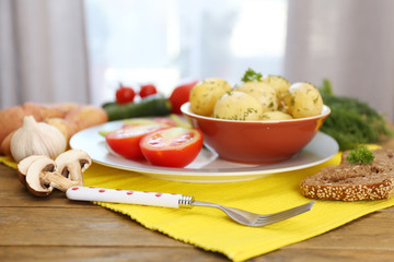 Young boiled potatoes with vegetables