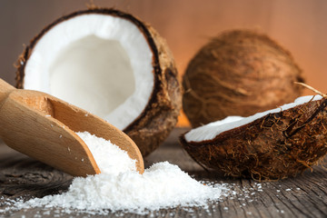 Close up of a coconut and grounded coconut flakes - 66015166