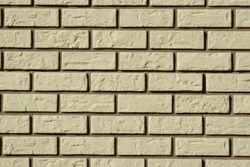 Wall made of white bricks with dark seams