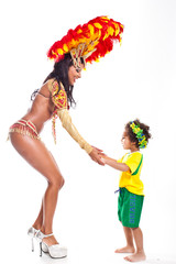 Brazilian child dancing with Samba girl