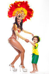 Brazilian child dancing with Samba girl