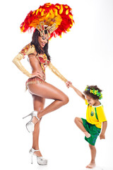 Brazilian child dancing with Samba girl