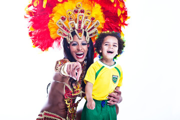 Fototapeta premium Brazilian child dancing with Samba girl