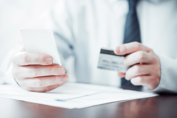 Smartphone and Credit Card in Hands