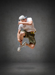 Obraz na płótnie Canvas male dancer jumping in the air