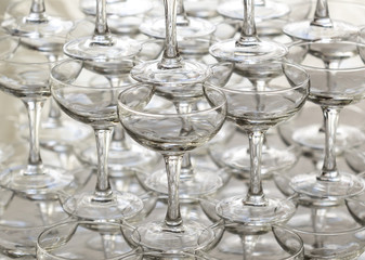 Pyramid holiday of champagne glasses on table in party